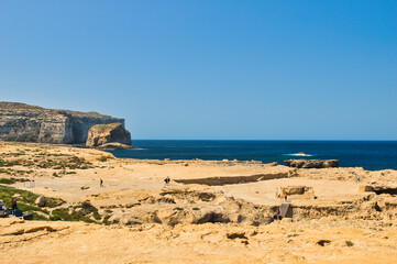 GOZO, MALTA -25 JUNE 2024- Fantastic views of rocky coast on a sunny day with blue sky. Picturesque and gorgeous scene. Location famous place Azure Window, Gozo island, Dwejra. Mediterranean sea Malta