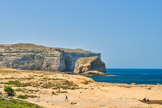 GOZO, MALTA -25 JUNE 2024- Fantastic views of rocky coast on a sunny day with blue sky. Picturesque and gorgeous scene. Location famous place Azure Window, Gozo island, Dwejra. Mediterranean sea Malta - Powered by Adobe