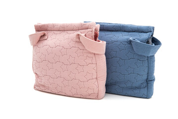 Two bags of different sizes on a white background, stylish and practical for carrying items.