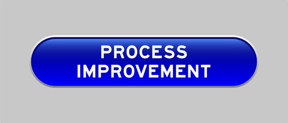 Blue color capsule shape button with word process improvement on gray background