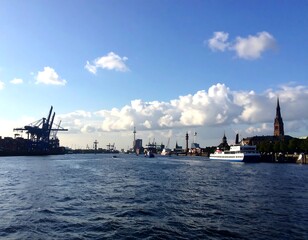 Fototapeta premium Harbor cityscape under a partly cloudy sky