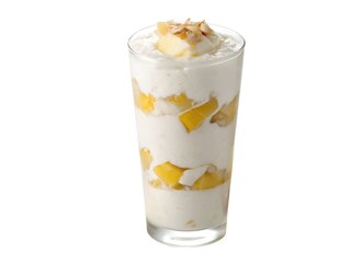 Coconut pineapple milkshake in clear glass with visible yellow fruit layers on clean white background