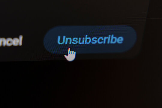 Mouse cursor clicking unsubscribe button on dark screen interface