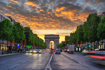 Sunset view of Paris Arc de Triomphe (Triumphal Arch) in Champs Elysees, Paris, France. Cityscape of Paris