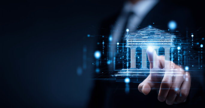 Businessman interacting with a digital hologram of a classical building facade, symbolizing modern banking or financial technology.