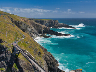 Stunning view of Mizen Heads rugged cliffs and vibrant turquoise ocean, capturing dramatic natural beauty in Ireland.