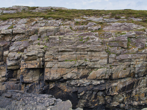 Detailed view of layered rock formations with fractures at Sheeps Head, Ireland, capturing natures artistry.