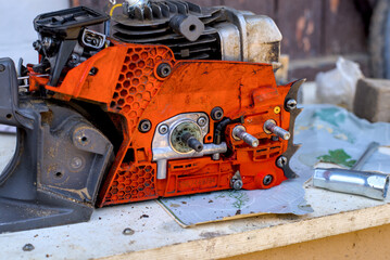 Photo of disassembled used chainsaw