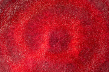 Macro texture of raw red beetroot top view, abstract vegetable cooking background.