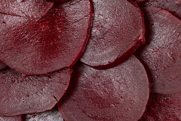 Texture of boiled red beetroot cut into slices top view