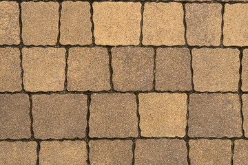 Tiled sidewalk background. Linear view of paving.
