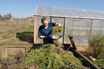 Young man engaged in household chores and small-scale rural farming, tending to his garden with care and dedication. His daily routine reflects a sustainable and self-sufficient way of life