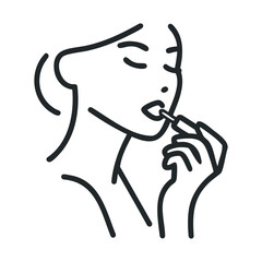 Beautiful woman applying lipstick with graceful gestures for makeup