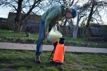 Young man engaged in household chores and small-scale rural farming, tending to his garden with care and dedication. His daily routine reflects a sustainable and self-sufficient way of life