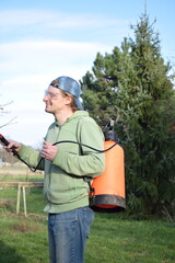 Young man engaged in household chores and small-scale rural farming, tending to his garden with care and dedication. His daily routine reflects a sustainable and self-sufficient way of life