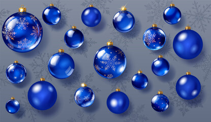 Set of glossy and matte Christmas ornaments in blue colors, smooth and decorated with intricate patterns. The balls have soft shadows and are set against a grey background with snowflakes.