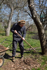 Young man engaged in household chores and small-scale rural farming, tending to his garden with care and dedication. His daily routine reflects a sustainable and self-sufficient way of life