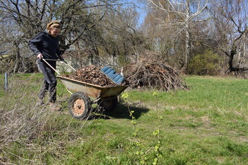 Young man engaged in household chores and small-scale rural farming, tending to his garden with care and dedication. His daily routine reflects a sustainable and self-sufficient way of life