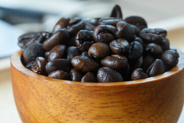Dark roasted coffee beans  ,close up with coffee beans background