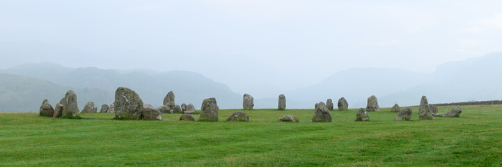 Panoramic view of Castlerigg Stone Circle on a hazy summer morning near Keswick in The Lake District, UK.
