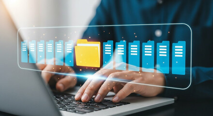 Person typing on laptop with digital data visualization overlay