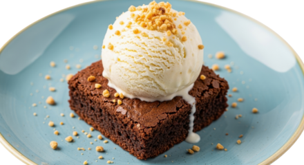 Chocolate brownie topped with vanilla ice cream and peanut sprinkles on a blue plate isolated PNG with Transparent Background