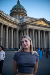 young woman in front of the building