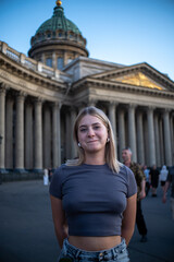 young woman in front of a building