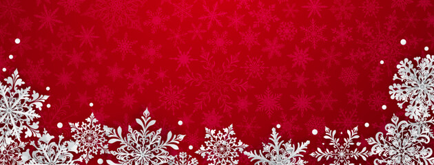 Christmas illustration featuring intricate paper snowflakes of varying sizes and designs arranged below, white on a red background with silhouettes of smaller snowflakes.
