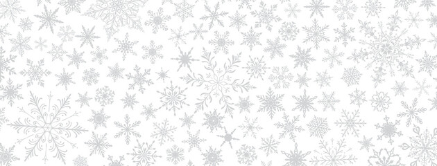 A vibrant Christmas illustration featuring various intricate snowflakes of varying sizes and designs, gray on white background.