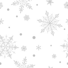 Christmas seamless pattern with big and small intricate snowflakes in various designs and small circles, gray on white background.