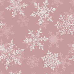 Christmas seamless pattern with two layers of large intricate snowflakes in various designs, white on pink background.