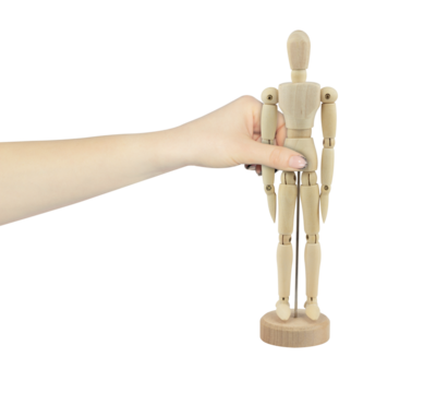 wooden man in hand, outstretched hand with wooden mannequin isolated from background
