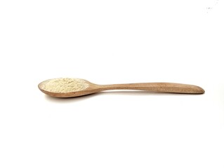 ginger powder on wooden spoon isolated on white background	