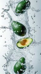 Fresh Avocados Splashing in Clear Water with Bubbles and Splashes