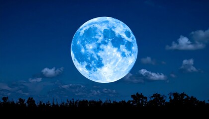 Fototapeta premium Blue moon over a dark landscape