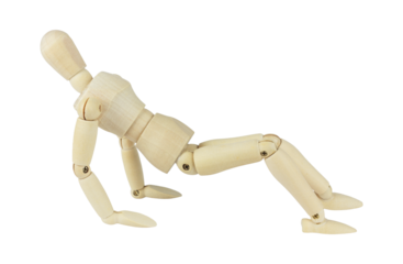 wooden man, wooden dummy doing exercise on floor, isolated from background