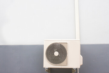 a heat pump on a house wall in the city