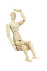 wooden man, wooden mannequin sitting looking into the distance isolated on background