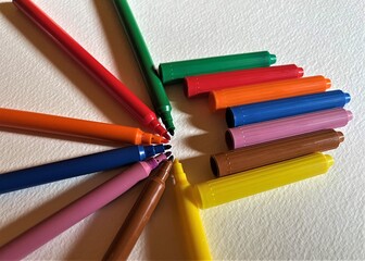 colored pencils on a white background