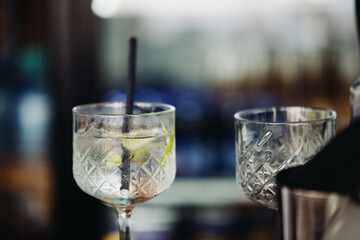 A glass with an unfinished drink in a wine glass at a beach cafe