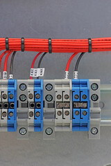Electrical terminals with connected insulated copper wires with metal lugs. Marking with a thermal...