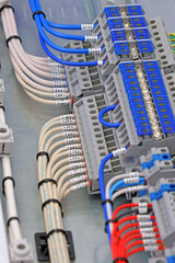 Electrical terminals with connected insulated copper wires with metal lugs. Marking with a thermal...