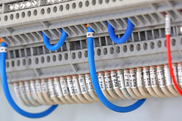 Electrical terminals with connected insulated copper wires with metal lugs. Marking with a thermal...