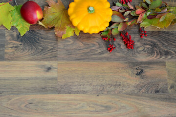 Autumnal Still Life Squash, Leaves, barberry branch and Fruit on Wood copy space