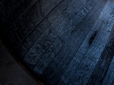 A whisky barrel being charred for storage