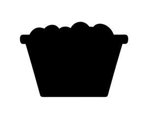 Silhouette of a bucket overflowing with round objects against a white background