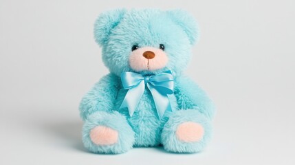 Cute blue teddy bear with ribbon sitting on a plain background