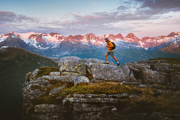 Man traveler hiking solo in Norway mountains travel vacations adventure outdoor healthy lifestyle...