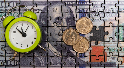 Puzzle Pieces of a $100 Bill, $1 Coin and Alarm Clock